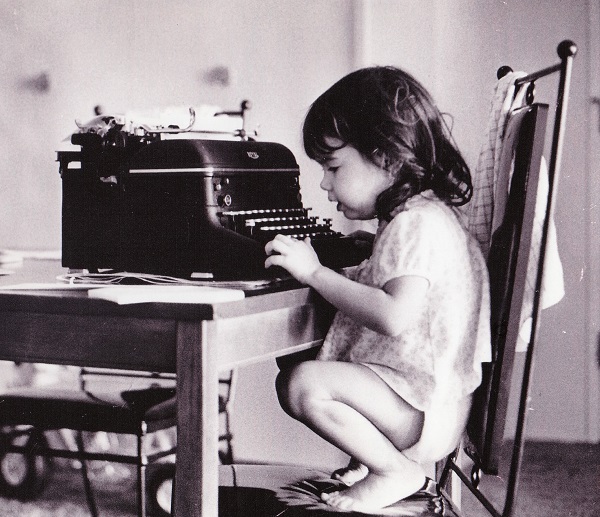 Little girl at typewriter